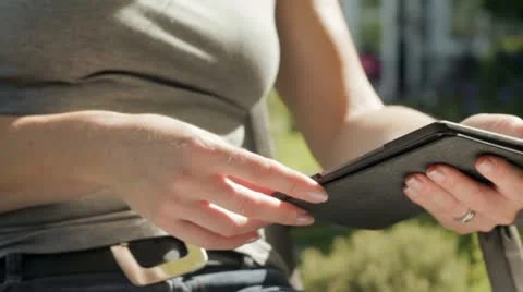 Woman with e-reader Stock Footage 11257886