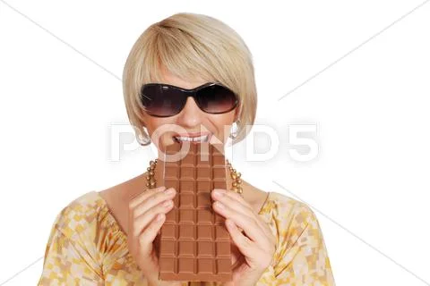 Woman eat chocolate.JPG Stock Photos