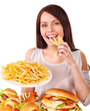 Woman eating fast food. Stock Photos