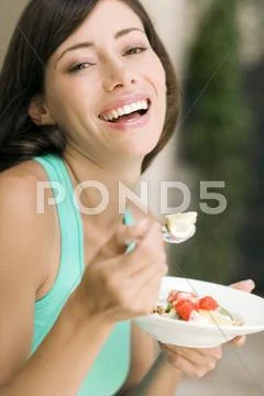 Woman Eating Fruit Salad
