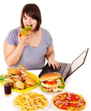 Woman eating junk food. Stock Photos