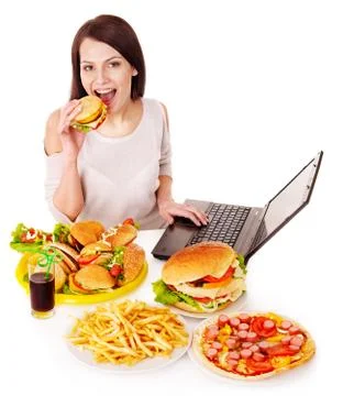Woman eating junk food. Stock Photos