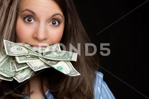 Woman eating money Stock-Fotos