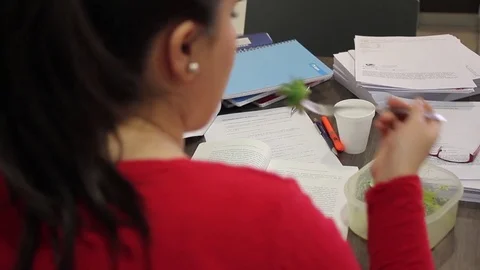 Woman eating office lunch Stock Footage 77046653