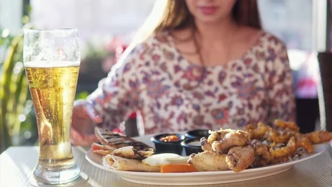 A woman eats at a cafe. Stock Footage 90312716