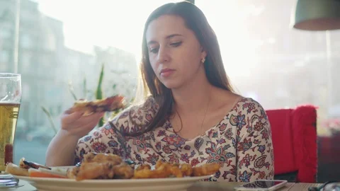 A woman eats at a cafe. Stock Footage 90467445