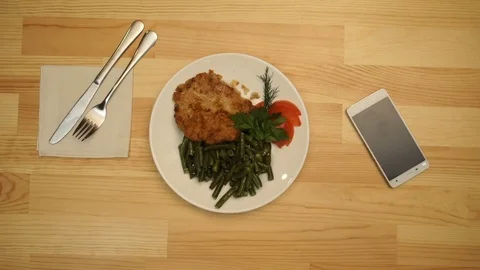 Woman eats in a cafe. top view timelapse Vidéo 70665194