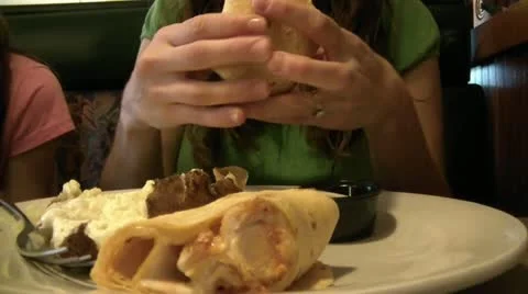 Woman Eats Drinks at Restaurant Video stock 12616661