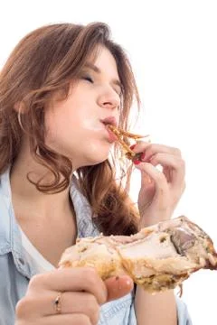 Woman eats fried chicken Photos