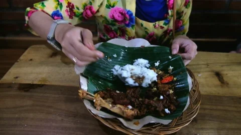 A Woman Eats Gudeg, close up. Stock Footage 169213896