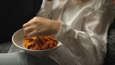 Woman eats healthy vegetatable chips hands shot 스톡 동영상 124719748