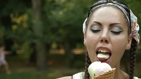 Woman eats ice-cream Stock Footage 11442880