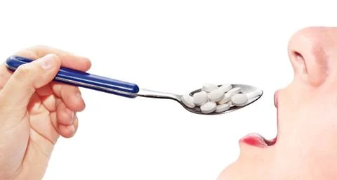 Woman eats pills Stock Photos