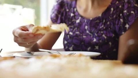 Woman eats pizza in cafe. Stock Footage 77634280
