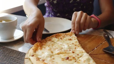Woman eats pizza in cafe. Stock Footage 77634324
