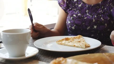 Woman eats pizza in cafe. Stock Footage 77634351