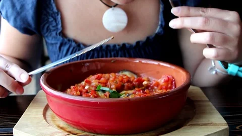 Woman eats vegetable dish Stock Footage 96371846