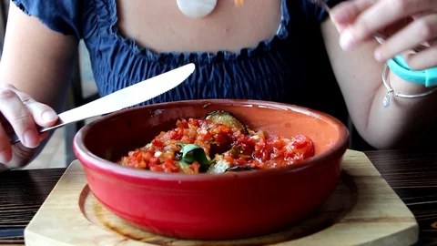 Woman eats vegetable dish Stock Footage 96371876