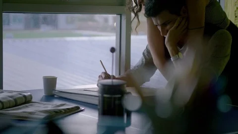Woman embracing a man while working in the office Stock Footage 75452789