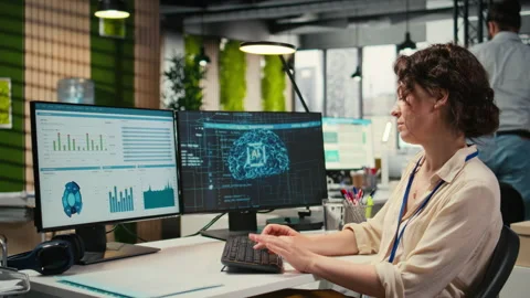 Woman employee using AI machine learning for efficiency recognition Stock Footage 313907450