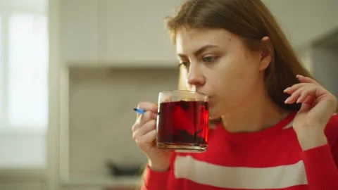 A woman is engaged in remote work, working on a laptop. Stock Footage 273328140