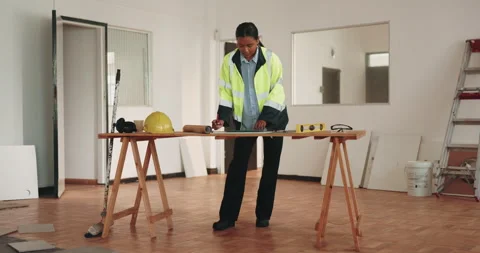 Woman, engineer and reading with tablet for construction, blueprint and research Stock Footage 341585071