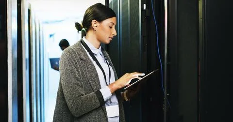 Woman, engineer and tablet in server room for software, update system and Stock Photos