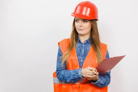 Woman engineer construction builder in helmet. Stock Photos