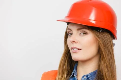 Woman engineer construction builder in helmet. Stock Photos