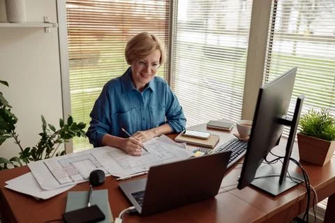Woman engineer construction is developing construction project documentation Stock Photos