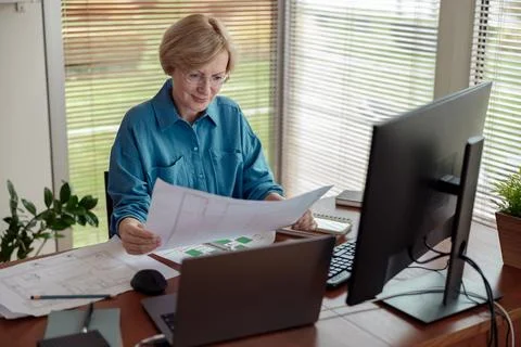 Woman engineer construction is developing construction project documentation Stock Photos