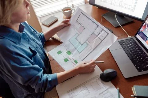 Woman engineer construction is developing construction project documentation Stock Photos