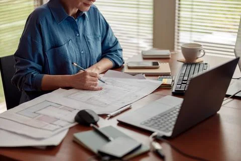 Woman engineer construction is developing construction project documentation Stock Photos