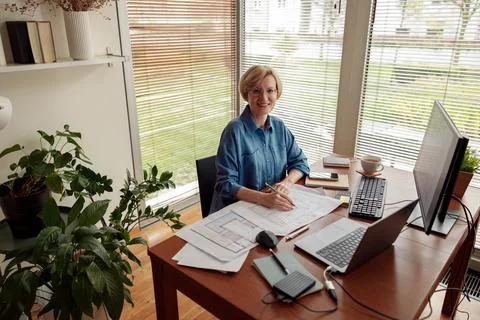 Woman engineer construction is developing construction project documentation Stock Photos