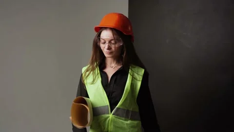 Woman engineer holding posing in studio Stock Footage 221265740