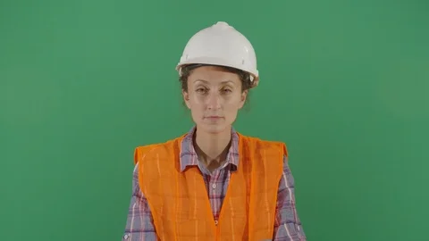 Woman engineer looking suspicious to the camera studio isolated shot against Stock Footage 119664220