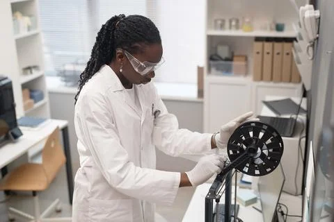 Woman Engineer Setting up 3D Printer Foto stock