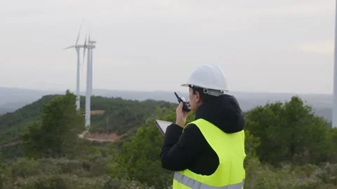 Woman engineer with tablet computer working with wind turbines Video stock 270454328