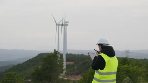 Woman engineer with tablet computer working with wind turbines Vídeos de archivo 270454425