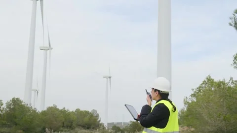 Woman engineer with tablet computer working with wind turbines Vídeos de archivo 270454875