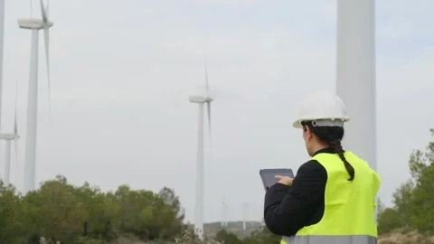 Woman engineer with tablet computer working with wind turbines Vídeos de archivo 270454926