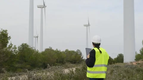 Woman engineer with tablet computer working with wind turbines Vídeos de archivo 270455075
