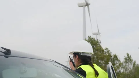 Woman engineer with tablet computer working with wind turbines Stock Footage 270455277