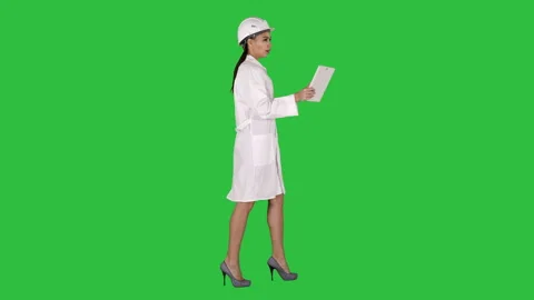 Woman engineer with tablet making video call on a Green Screen, Chroma Key. Stock Footage 102293717
