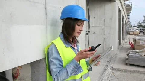 Woman engineer using tablet and walkie-talkie Stock Footage 14823490