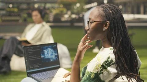 Woman engineering student using AI neural networks on laptop screen Stock Photos