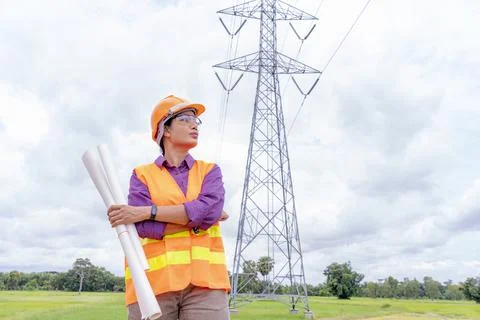 Woman engineers construction worker checking layout on digital ipad or comput Stock Photos