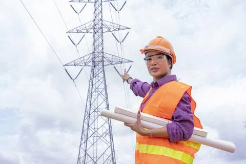 Woman engineers construction worker checking layout on digital ipad or comput Stock-Fotos