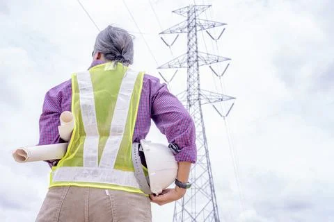 Woman engineers construction worker checking layout on digital ipad or comput Stock Photos