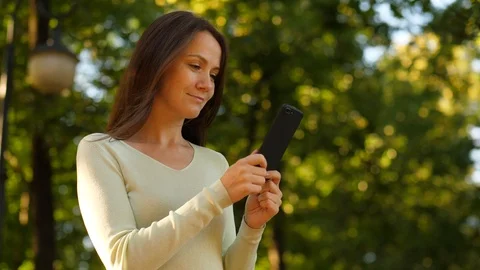 Woman enjoy using smartphone, reading from phone screen Stock Footage 92032071